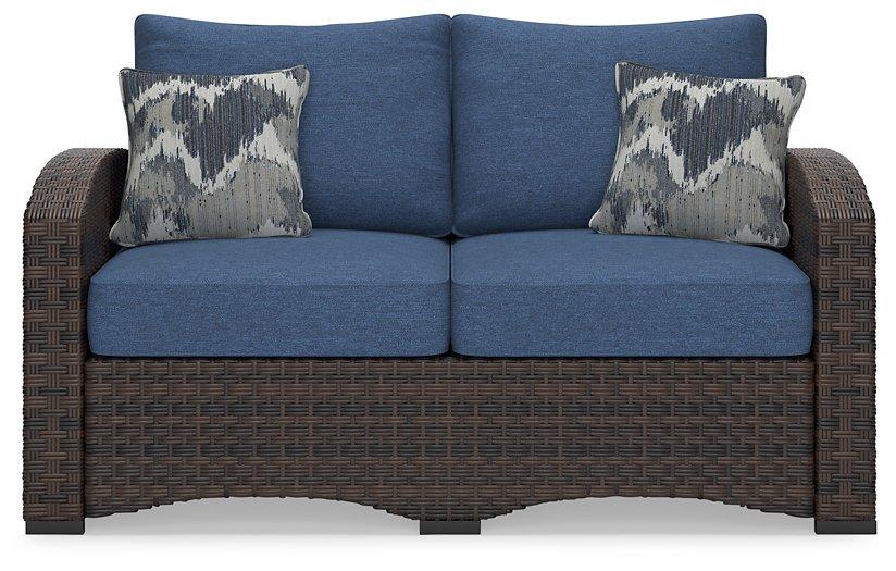 Windglow Outdoor Loveseat with Cushion - Zara Furniture (Kissimmee,FL)